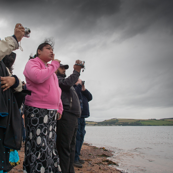 Family have a wonderfully intimate and moving encounter with wild bottlenose dolphins, Moray Firth, Scotland © John MacPherson