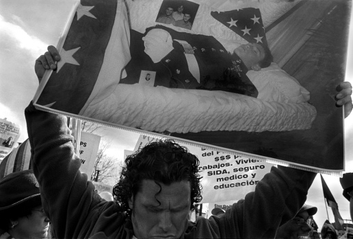 Carlos Arredondo holds a photograph of his son Alex. From Eugene Richards' September 2010 book War Is Personal. © Eugene Richards 