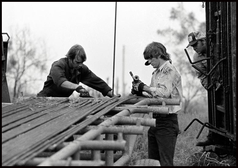 Oil workers on a drill rig, West Texas 1980 © John MacPherson