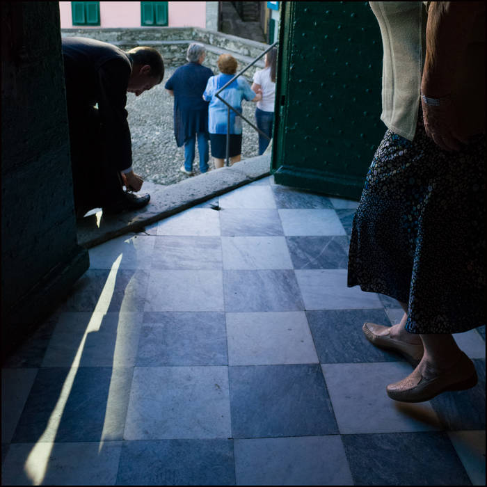 The priest ties his shoelace, Liguria @John MacPherson