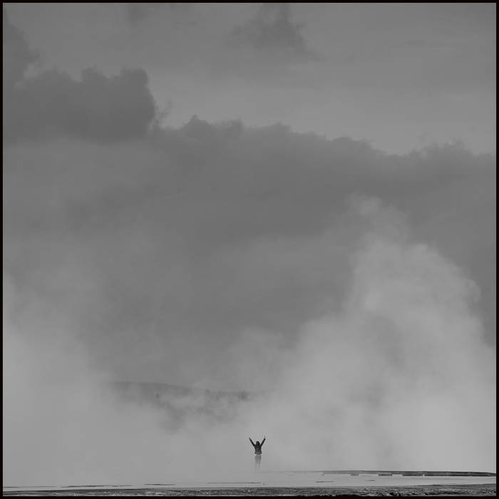 Tourist overcome with the experience, and saluting the geyser, Yellowstone © John MacPherson