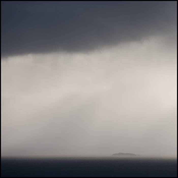 Coastal rain and mist, and an island © John MacPherson