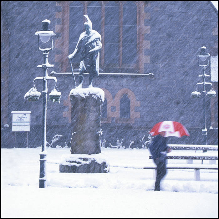 Man with umbrella in blizzard, Scotland © John MacPherson