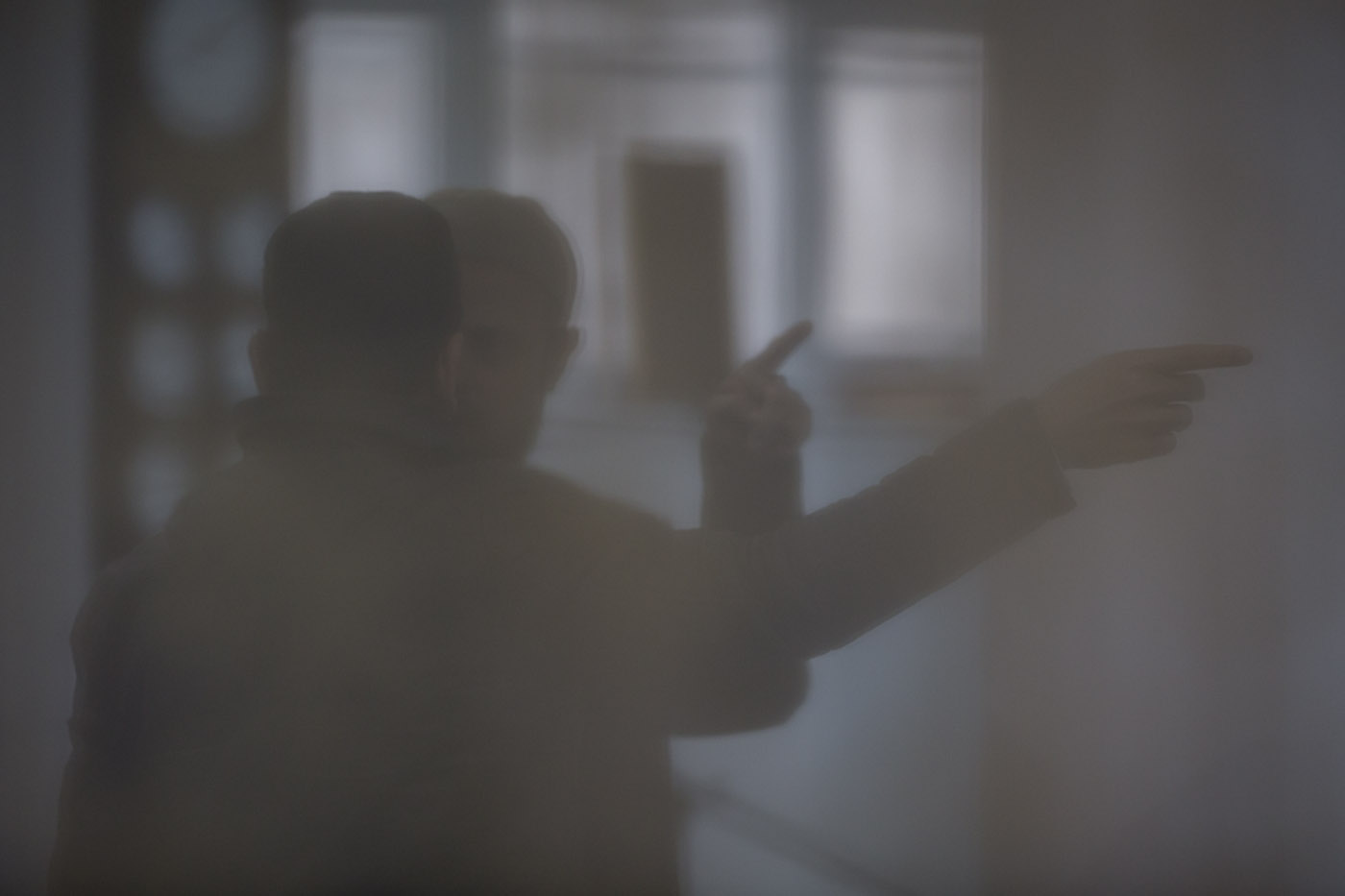Two members of the congregation have a deep discussion after Friday prayers, Inverness Masjid, Inverness, Scotland, February 2015 Image ©John MacPherson